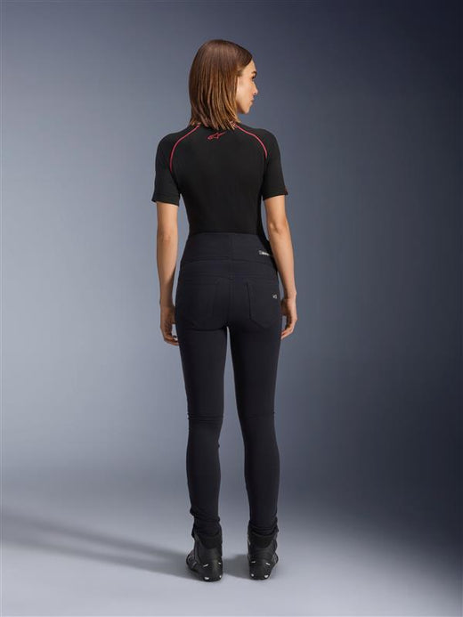 Alpinestars Stella Flex-Ast Leggings, Women's Motorcycle Leggings, Black, rear view showing high-waisted slim fit, worn with black short-sleeve top and black riding boots, urban riding gear