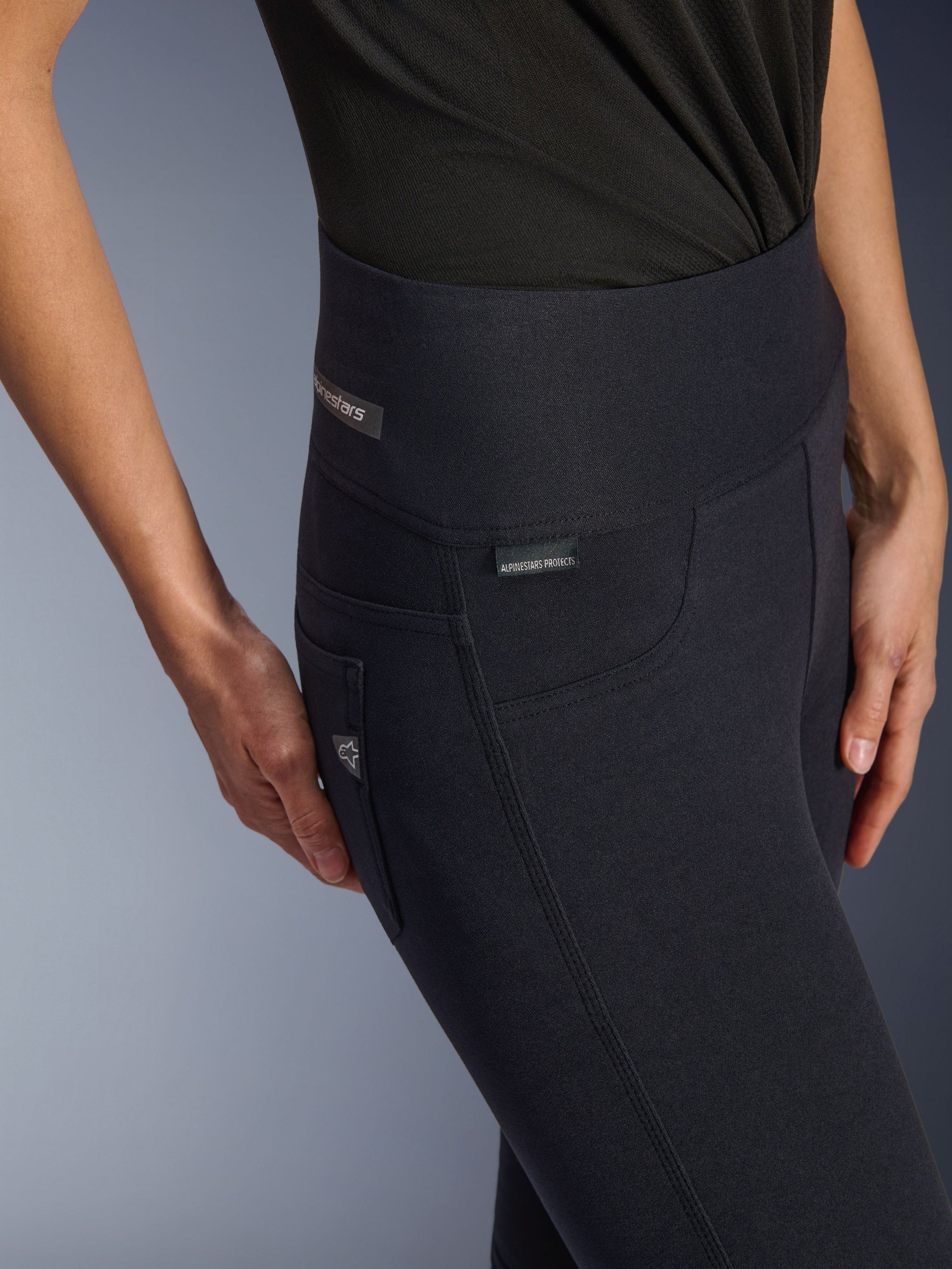 Alpinestars Stella Flex-Ast Leggings, Women's Motorcycle Riding Leggings, Black, close-up shot of high waistband and hip area featuring subtle branding tags, sleek urban design for road riding