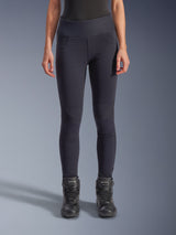Alpinestars Woman Stella Flex-AST Leggings - Short, Women's Motorcycle Riding Leggings in Black, high-waisted skinny fit with accordion knee panels, worn with black Alpinestars riding boots, urban riding gear