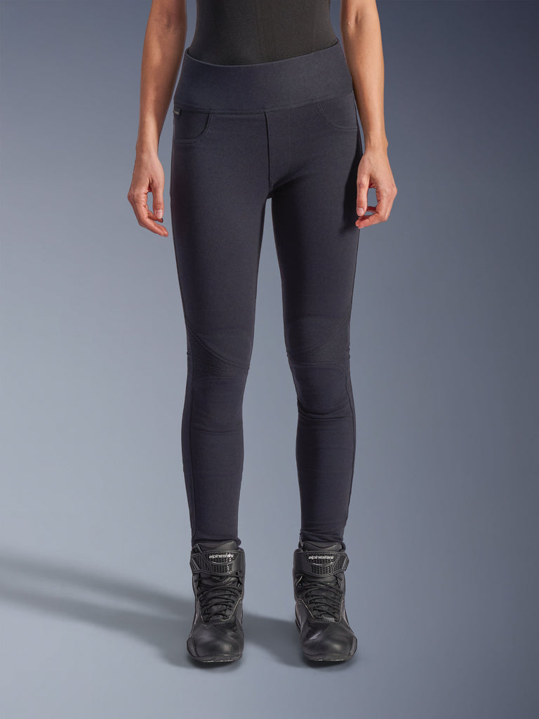 Alpinestars Stella Flex-Ast Leggings, Women's Motorcycle Leggings, Black, high-waisted fit with articulated knee panels and contoured seams, worn by model with black riding boots, urban performance riding apparel