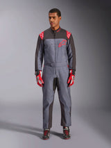 Alpinestars KMX-9 V3 Graphic 6 Suit, Karting Suit, Anthracite Black and Red, gray speckled graphic pattern, black panels on inner arms and legs, red Alpinestars logos on shoulders and chest, worn with red racing gloves and black shoes
