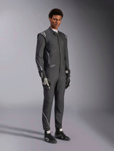 Alpinestars Hypertech V3 Suit, Auto Racing Suit, Black and Dark Shadow, worn by male model with matching black gloves and racing shoes, athletic slim fit, features Alpinestars logos and light gray accents, professional motorsport protective gear