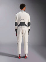 Rear view of a model wearing the Alpinestars Hypertech V3 Suit in White Black Silver, showcasing the large black lumbar stretch panel with 'alpinestars' and 'RACING AHEAD' branding, black elbow inserts, FIA certification label on the collar, and an athletic-slim fit designed for professional racing.