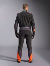 Alpinestars KMX-5 V3 Suit, men's black and orange fluo one-piece karting suit, FIA certified, rear view showing branding.