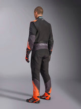 Alpinestars KMX-5 V3 Karting Suit, Men's rear view in black and orange fluo, FIA 8877-2022 Grade 1 certified.