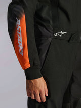Alpinestars KMX-5 V3 Karting Suit, Men's Black and Orange Fluo, with ASTARS sleeve branding and breathable tech mesh panels.