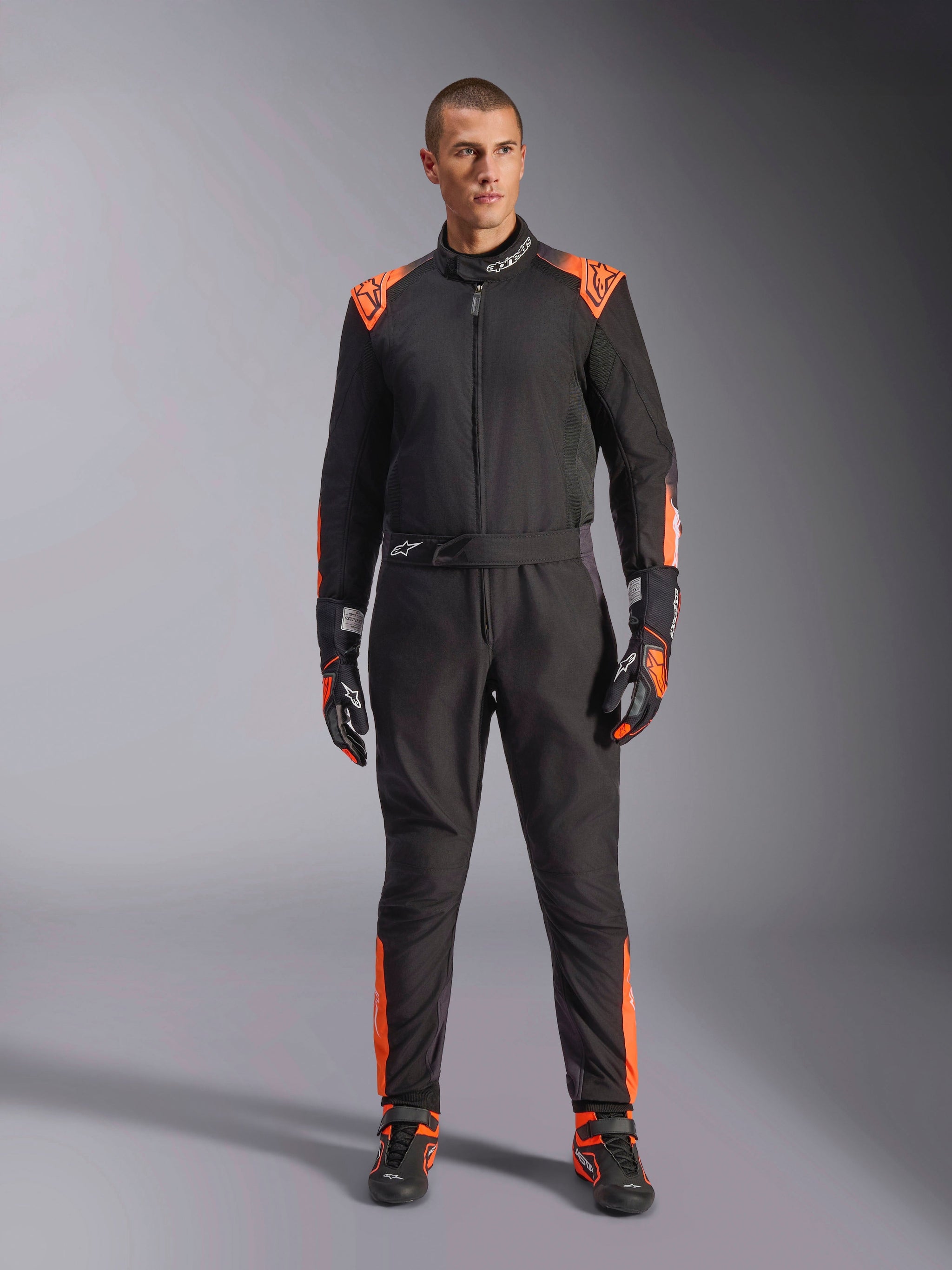 Alpinestars KMX-5 V3 Suit, Men's Karting One-Piece, Black and Orange Fluo, FIA 8877-2022 Grade 1 certified racing gear.