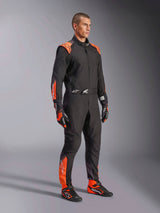 Alpinestars KMX-5 V3 Karting Suit, Men's Black and Orange Fluo, FIA Grade 1 textile racing one-piece worn by a model.