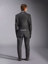 Alpinestars GP Tech V4 Suit, Auto Racing Suit, Black and White, back view featuring white Alpinestars branding and FIA certification on the collar, sleek ergonomic fit for professional driver protection