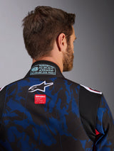 Close-up of Alpinestars KMX-9 V3 Graphic 5 Suit, Karting Suit in Navy Red, featuring blue and black camouflage pattern, white star logo and red brand label on the upper back, with FIA 8877-2022 certification patch on the collar