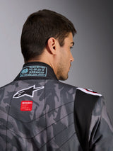 Alpinestars KMX-9 V3 Graphic 5 Suit, Karting Suit, Dark Gray and Black camouflage pattern, close-up of the upper back showing the Alpinestars logo, red branding tag, and FIA homologation label on the collar.