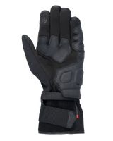 Alpinestars Tourer W-7 V2 Drystar® Gloves, Black motorcycle gloves, palm view featuring leather reinforcements, padded grip areas, touchscreen-compatible fingertip, and secure wrist strap closure.