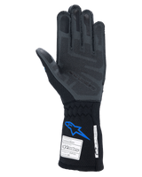 Alpinestars Tech-1 ZX V4 Gloves, Auto Racing Gloves, Black and Blue, palm view showing grey 3D silicone grip technology, featuring FIA and SFI certification tags on the cuff, professional motorsport protection