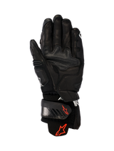 Alpinestars GP Plus R V3 Leather Gloves, Black, palm view showing durable leather construction, red Astars logos on the wrist strap and cuff, reinforced grip panels, and an adjustable closure for racing and sport performance.