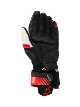 Alpinestars GP Plus R V3 Leather Gloves, Racing/Sport Motorcycle Gloves, Black White and Bright Red, palm view showing reinforced leather construction, palm sliders, and an aramid stretch cuff, featuring a secure wrist strap with Alpinestars logo and ergonomic pre-curved design