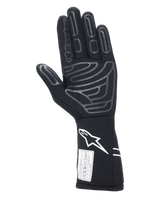 Alpinestars Tech-1 Start V4 Gloves FIA, Black Auto Racing Glove, palm view featuring grey silicone grip patterns on fingers and palm, white Astars logo on the extended cuff, FIA certification label, professional motorsport gear