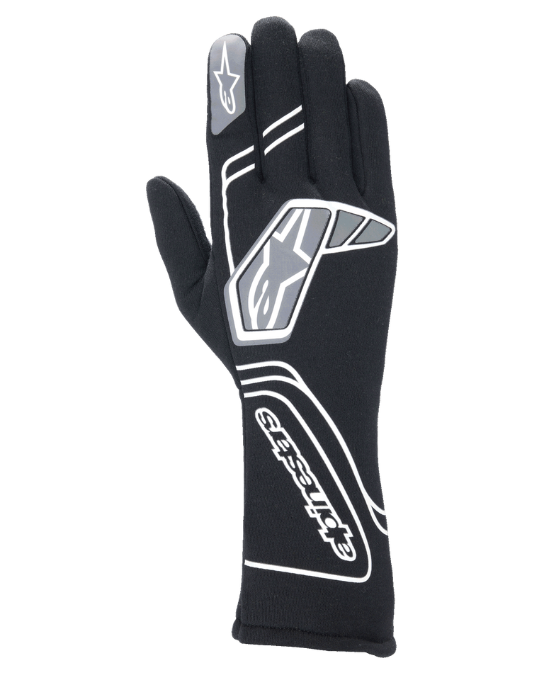 Alpinestars Tech-1 Start V4 Gloves FIA, professional auto racing gloves in Black, featuring white and grey geometric patterns with Alpinestars branding, extended cuff for fire and heat protection, lightweight pre-curved design for motorsport use