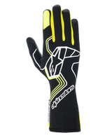 Alpinestars Tech-1 Race V4 Gloves, Auto Racing Gloves, Black with Yellow Fluo and White accents, featuring a large star logo on the back and smaller star on the index finger, sleek design with geometric patterns and extended gauntlet cuff