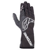 Black motorcycle glove with white Alpinestars logo and ASTARS branding, sleek matte finish, full finger coverage with reinforced stitching, modern sporty design
