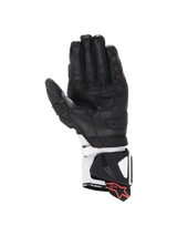 Alpinestars GP Pro R4 motorcycle racing gloves in black and white leather with a kangaroo palm and DFS gauntlet cuff.