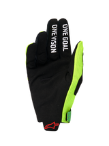 Alpinestars 2026 Radar Pro Gloves, palm view of a motocross glove, black synthetic suede with 'ONE GOAL' and 'ONE VISION' white text on fingers, bright fluo yellow mesh side panel, red Alpinestars logo on the wrist, minimalist performance gear for off-road riding
