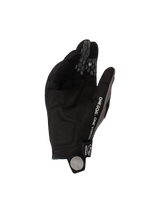 Alpinestars 2026 Pro-Dura Gloves, Black Gray, view of synthetic suede palm and silicone honeycomb finger grips, featuring 'ONE GOAL. ONE VISION.' text and white spiral logo on the pull tab, durable off-road motorcycle gear