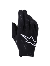 Alpinestars Supertech MX Gloves, Motocross Gloves, Black and White, backhand view featuring a large white Astars logo, laser-cut perforations for ventilation, and a seamless ergonomic design for off-road racing