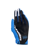 Alpinestars Supertech MX Gloves, Motocross Gloves, Ucla Blue and Deep Blue with White accents, palm view showing black perforated material, white Alpinestars logo, silicone finger grips, and technical text, professional off-road racing gear