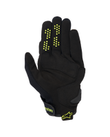 Alpinestars Chrome V2 Gloves, Short Cuff Motorcycle Gloves, Black with neon yellow accents, palm view showing synthetic suede construction, silicone grip dots on fingers, and hook-and-loop wrist closure with Alpinestars branding.