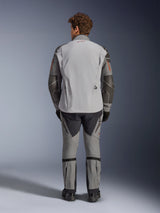 Alpinestars Nazca 3L GORE-TEX PRO Jacket, rear view, Dark Gray and Mid Gray, adventure motorcycle jacket with GORE-TEX construction, red logo on collar, orange sleeve details, worn with matching riding pants and black gloves.