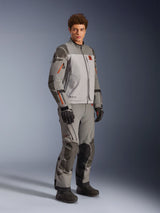 Alpinestars Nazca 3L GORE-TEX PRO Jacket in Dark Gray Mid Gray, adventure motorcycle riding outfit worn with matching pants and black gloves, featuring orange zipper accents, protective Superfabric® reinforcements, and GORE-TEX branding.