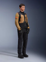 Alpinestars ST-7 2L GORE-TEX Jacket, Motorcycle Jacket, Gobi Brown and Black, worn by a model with matching black pants and gloves, featuring brown panels on the chest and sleeves, black technical accents, and orange branding, adventure-touring motorcycle gear.