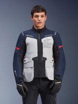 Alpinestars ST-7 2L GORE-TEX Jacket, Motorcycle Adventure Touring Jacket, Ice Gray and Dark Blue with Red accents, Waterproof and breathable, worn by a model with black gloves, featuring Alpinestars Exploration Equipment branding on the chest