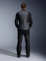 Alpinestars ST-7 2L GORE-TEX Jacket, Deep Gray Black and Dark Khaki, rear view on a model, adventure motorcycle touring jacket with gray back panel and black articulated sleeves, worn with matching black pants.
