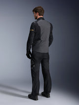 Alpinestars ST-7 2L GORE-TEX Jacket, Deep Gray and Black with Dark Khaki accents, rear view of a rider wearing the jacket and matching motorcycle pants, adventure touring gear with waterproof laminated construction