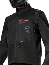 Alpinestars Pro-Dura Jacket, Black off-road motorcycle jacket featuring red Alpinestars branding and a gray circular Astars logo on the chest, zippered hand pockets, and durable ripstop textile construction, rally-inspired design for enduro riding.