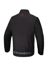 Alpinestars Lite-Dura Softshell Jacket, Black, Rear view, featuring a small red logo on the neck, large gray Alpinestars wordmark on the lower hem, and a vertical zippered rear storage pocket, technical off-road gear for enduro and motocross.