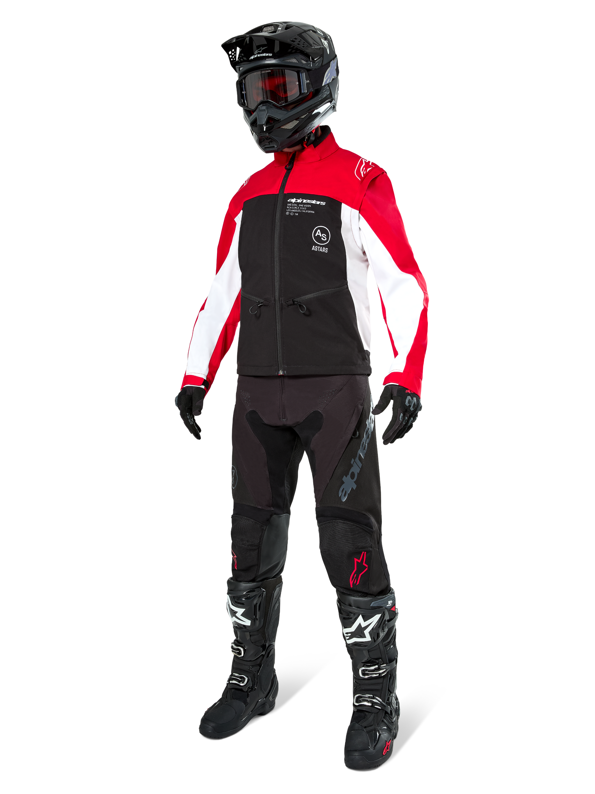 Motocross rider wearing the Alpinestars Lite-Dura Softshell Jacket in Black, Bright Red, and White, featuring a black body with red and white sleeves, paired with black pants, a black helmet with red goggles, and black and white boots, complete off-road racing outfit.