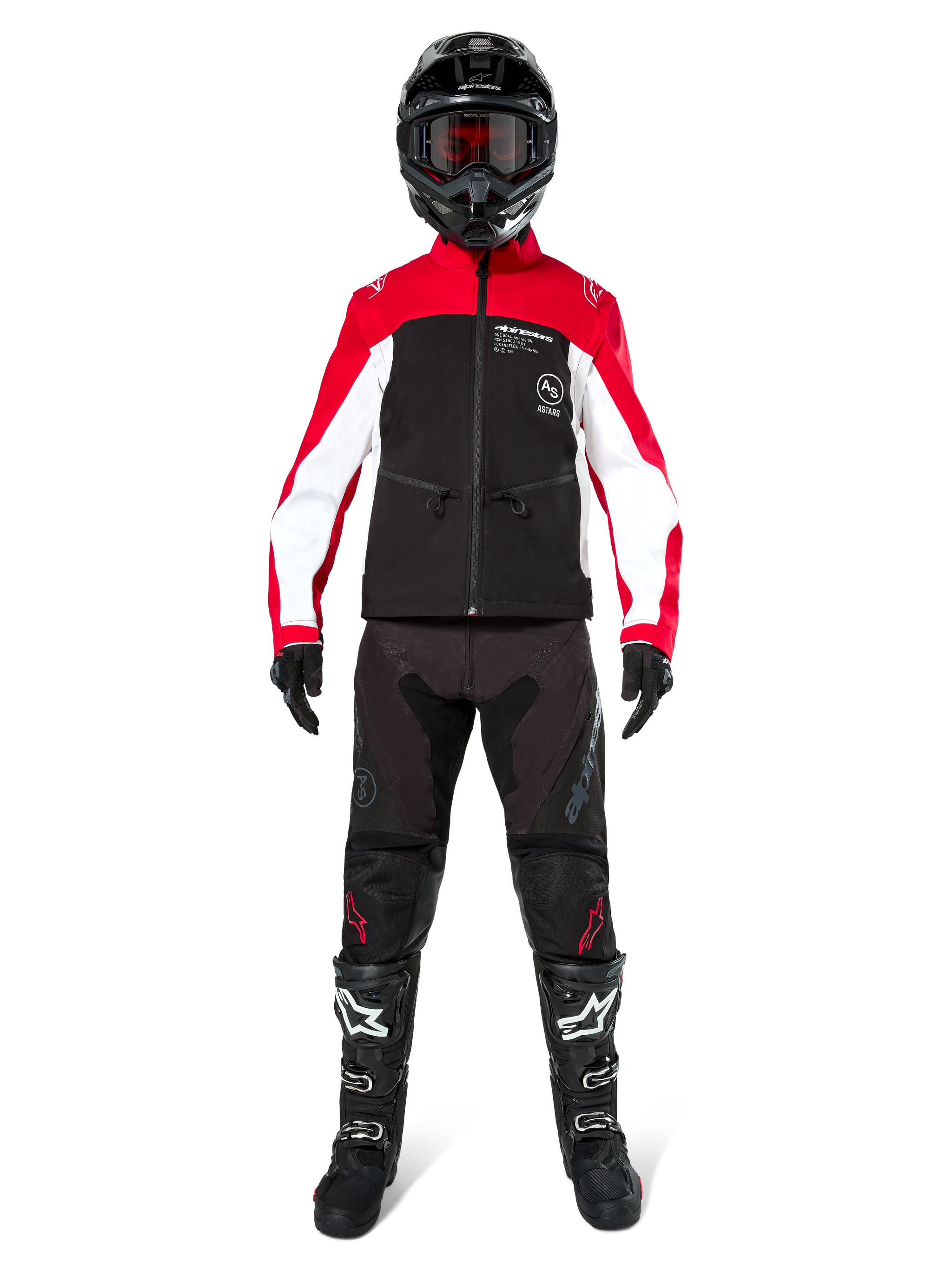 Motocross rider wearing the Alpinestars Lite-Dura Softshell Jacket in Black, Bright Red, and White, coordinated with black off-road pants, black and white boots, and a black helmet with goggles, complete gear setup for enduro racing