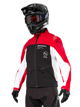 Alpinestars Lite-Dura Softshell Jacket, Motorcycle Jacket, Black, Bright Red, and White, worn by a rider with a black motocross helmet, red goggles, and gloves, featuring bold branding on the chest, designed for off-road and enduro riding