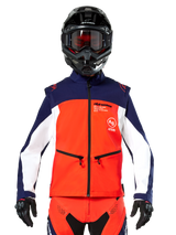 Alpinestars Lite-Dura Softshell Jacket in Navy, Hot Orange, and White, front view on a rider wearing a black helmet and goggles, featuring a color-blocked technical design with zippered hand pockets and Alpinestars branding, versatile gear for enduro and off-road riding