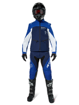 Alpinestars Lite-Dura Softshell Jacket, Off-Road Motorcycle Jacket in Navy, Bright Blue, and White, worn with a matching full gear set including a black helmet, enduro pants, and black boots, technical windproof apparel for dirt bike riding