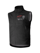 Alpinestars Techstar Softshell Vest, Black Sleeveless Motocross Vest, high collar with front zipper, featuring red star logo with "ASTARS" and "ONE GOAL. ONE VISION." chest branding, lightweight windproof softshell fabric with light gray interior lining, designed for off-road riding