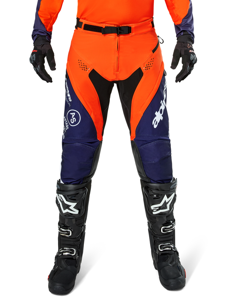 Alpinestars Pro-Dura Pants, Motocross and Enduro Pants, Navy Hot Orange and White, featuring black panels and white logos, worn with black off-road boots and gloves, professional protective gear for trail and off-road riding