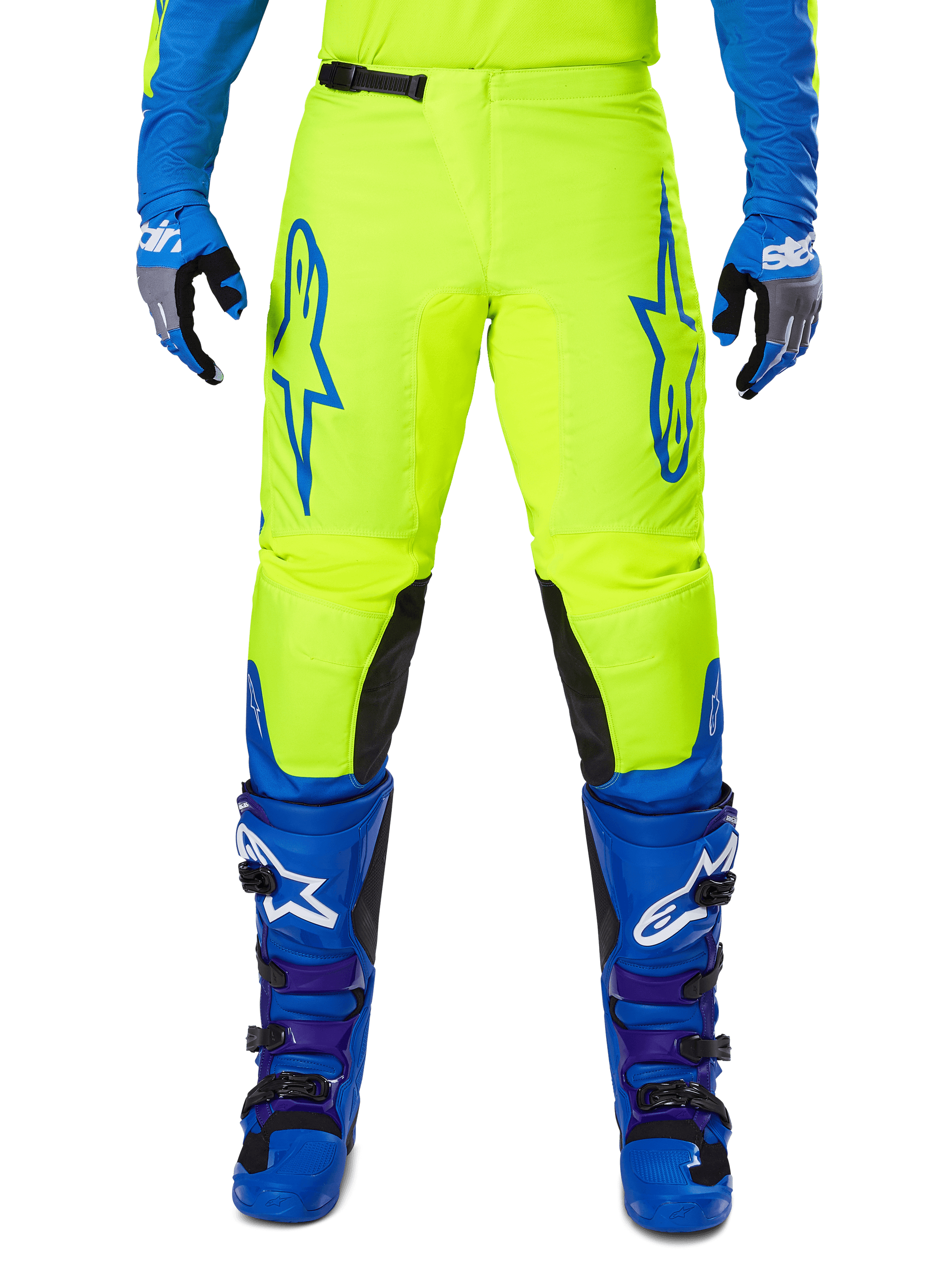 Alpinestars 2025 Fluid Haul Pants, Motocross Pants, Bright Yellow and Blue, worn with matching gloves and boots, featuring black inner knee panels, bold blue branding on the thighs, and a sporty ergonomic design.