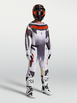 Alpinestars Techstar Swan Motocross Gear Set, men's racing pants and jersey in Light Lilac and Red Fluo with white boots.