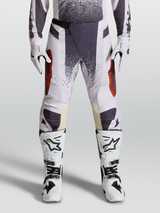 Alpinestars Techstar Swan Motocross Pants, Lilac and Dark Gray, featuring red accents and magnetic buckle.