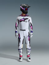 Motocross rider wearing a complete racing gear set, Alpinestars 2026 Supertech AFD Vista Pants and jersey in White Purple and Black, matching gloves, white and black boots, black helmet with purple goggles, sleek athletic fit for off-road performance
