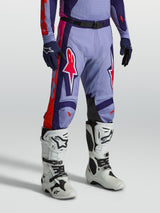 Alpinestars Racer Air Hunt Pants, ventilated purple and pink motocross gear shown on-model with white boots.