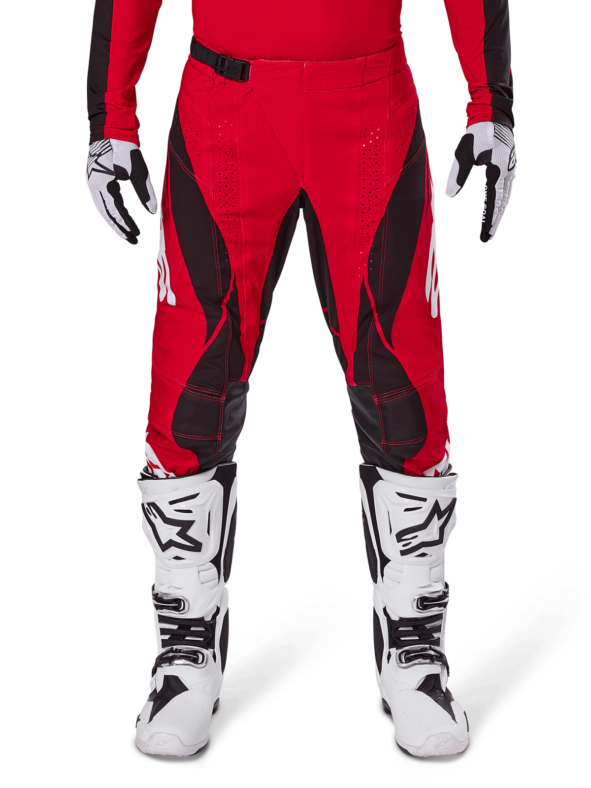 Alpinestars 2025 Techstar Dreem Pants, Motocross Pants, Bright Red and Black, featuring angular patterns and laser-cut ventilation holes, worn with white motocross boots and matching gloves for off-road racing